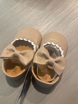 2 Cute little Girls Shoes one black one tan new size 6/12 months