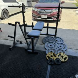 Bench press with 7ft 45lbs bar plus 235lbs of Olympic weights and weights tree