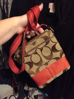 Brown and orange Coach purse