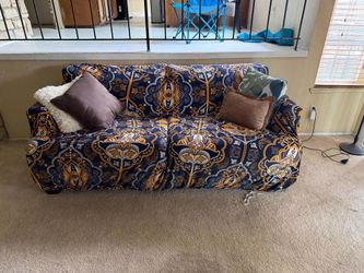 Burgandy Couch with elegant couch cover