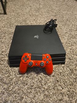 PS4 Pro with Red Dual Shock Controller