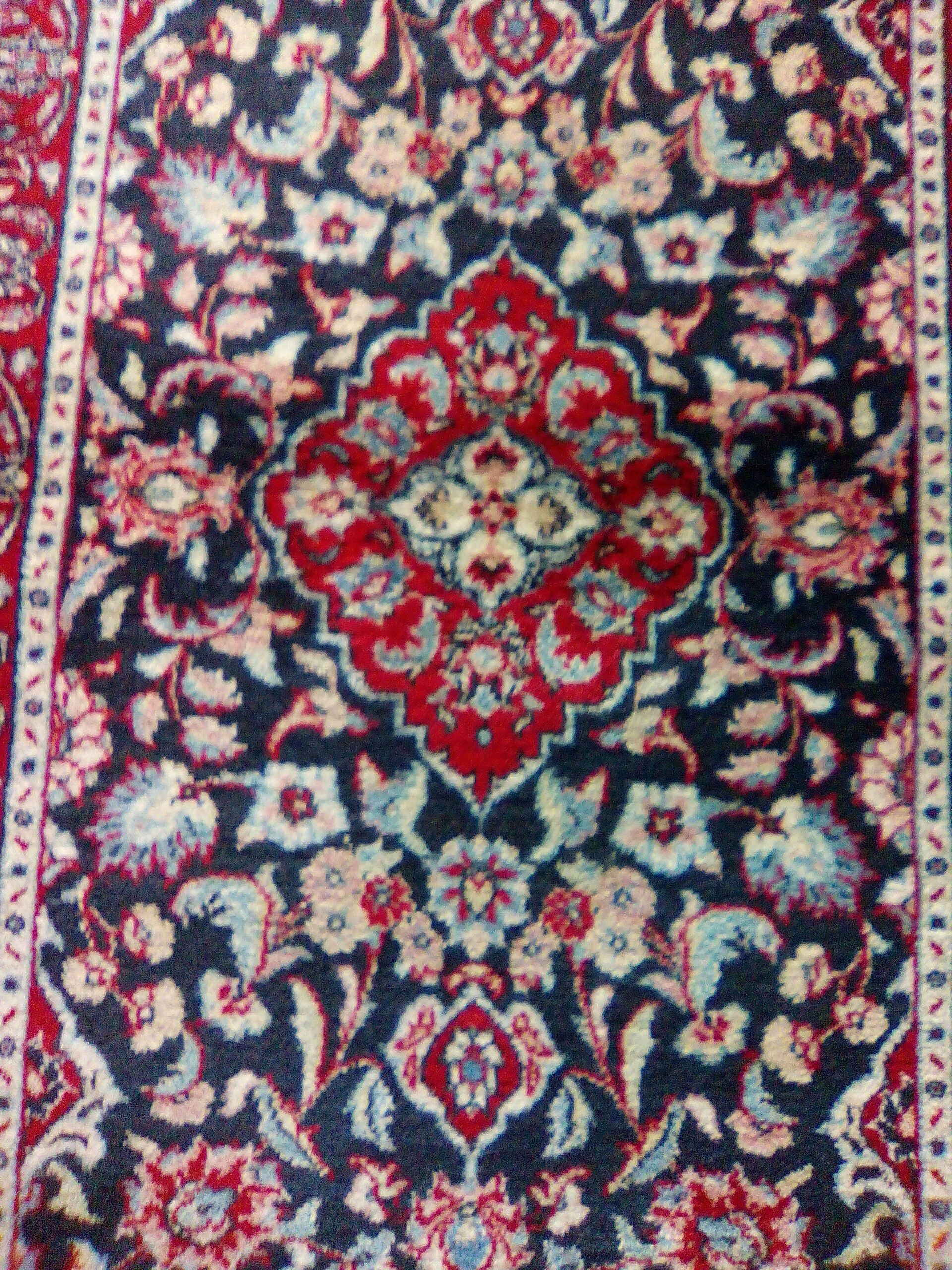 Hand woven Persian designed 5x3 blue and white and red colors.