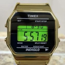 Timex Classic Digital watch in a gold tone with an expansion band and Indiglo backlight. 