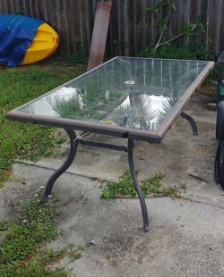 Out Door Glass Top Table 68inch x 40inch Priced to move