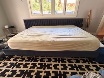 Massive “Alaskan King” bed with custom navy velvet headboard