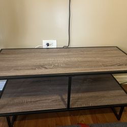 This is a modern industrial-style TV stand or media console table