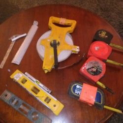 BUNCH OF TAPE MEASURES AND OTHER MEASUREMENT TOOLS
