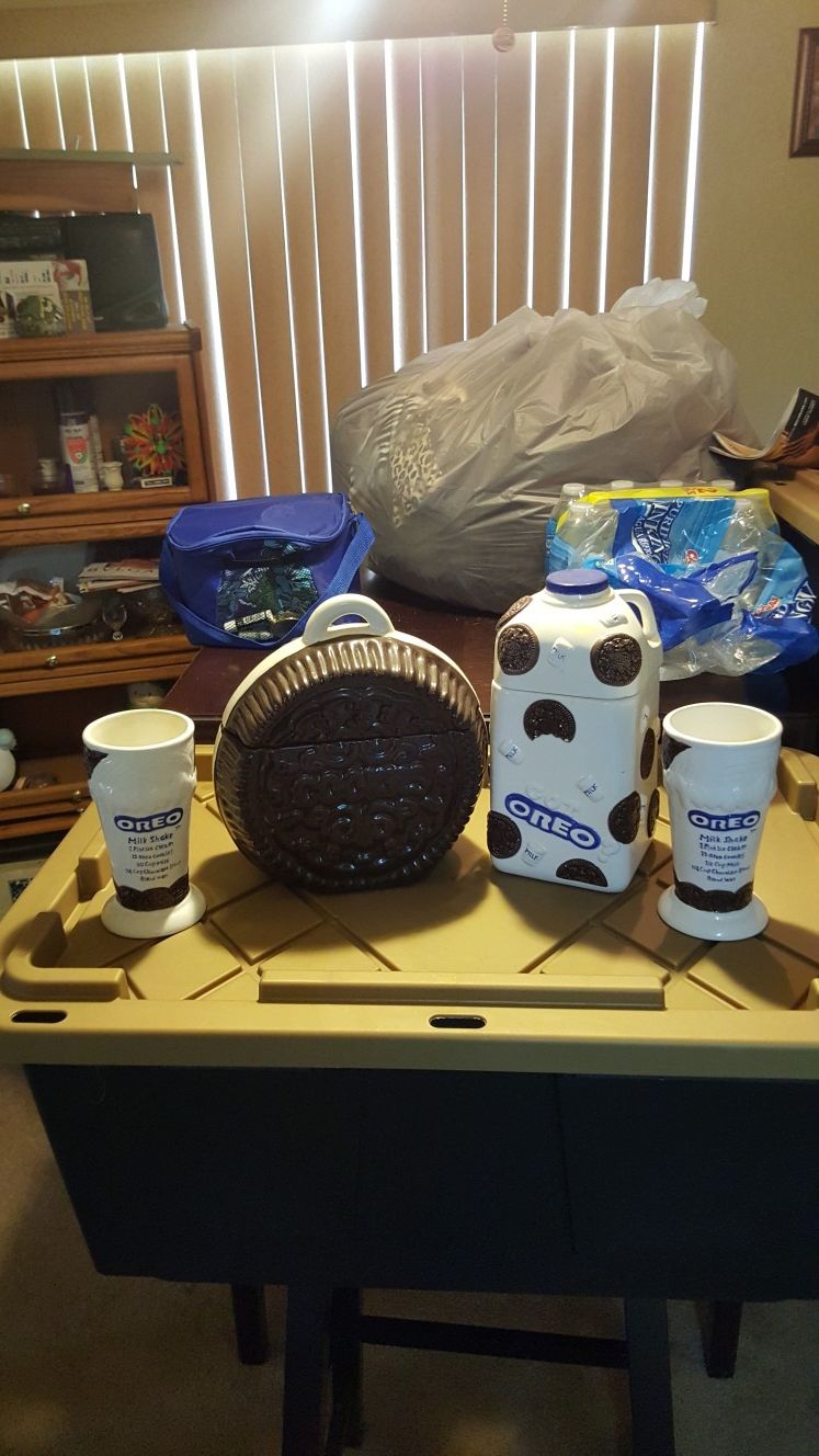 Houston harvest and Nabisco Oreo cookie jars with two glasses
