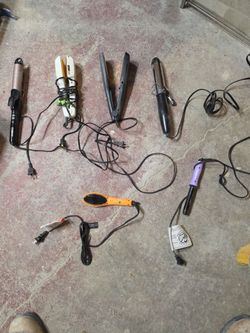 7 hair styling tools: curling irons, flat iron, crimper, heated brush, hair dryer, and curling wand