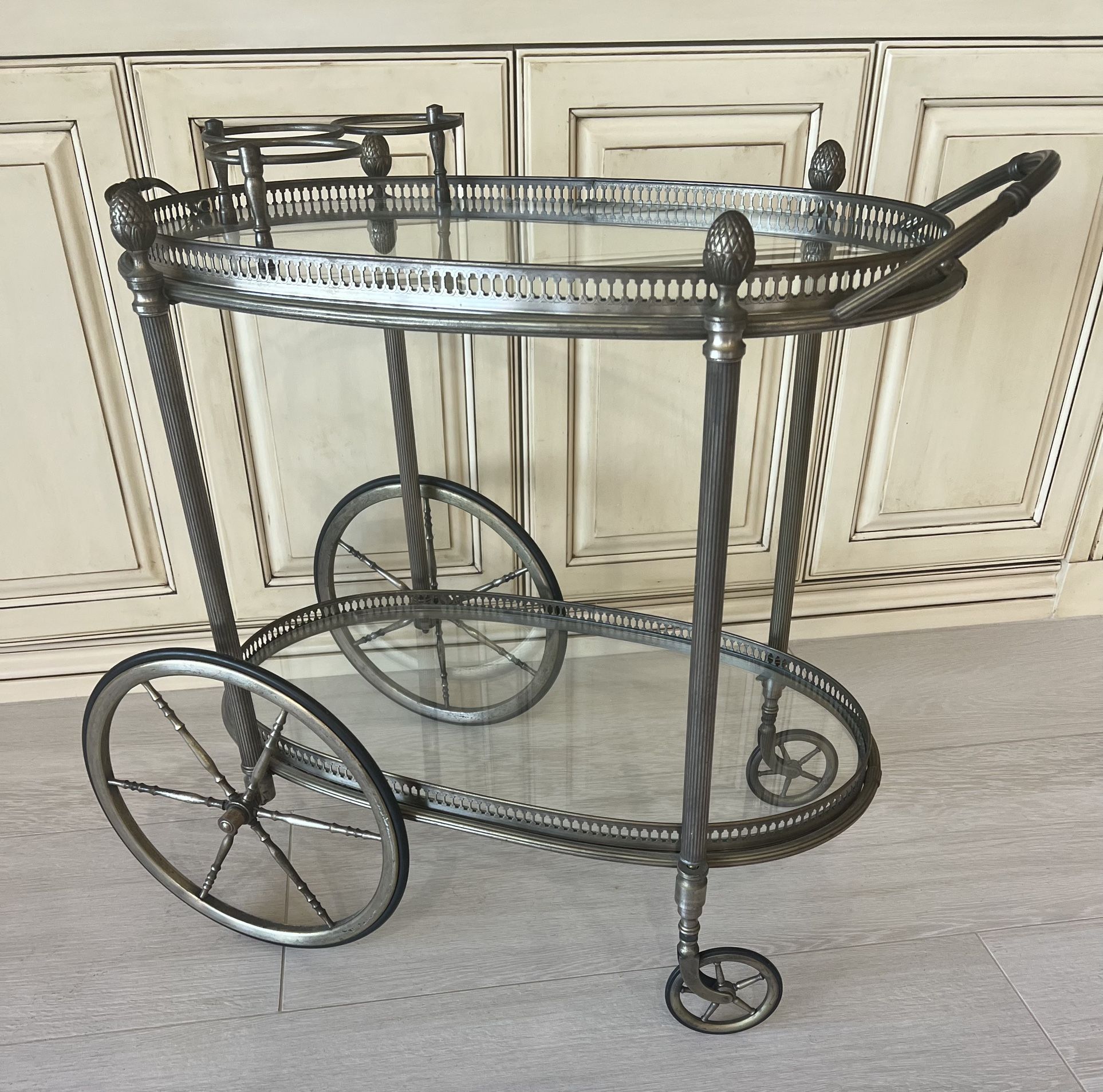 Bar Cart In Glass And Metal with 3 Rings For Wine Bottles. Has 4 Wheels And Is In Perfect Condition.  