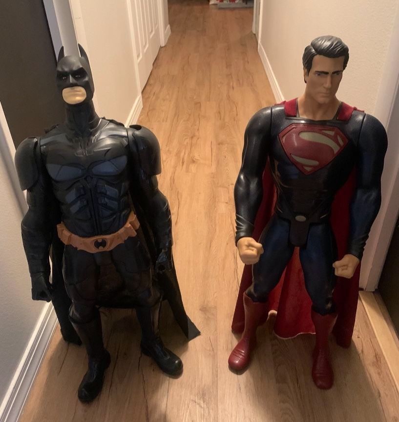 Batman and superman statues