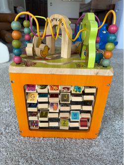 B. Toys Zany Zoo Wooden Activity Cube Toddler Toy