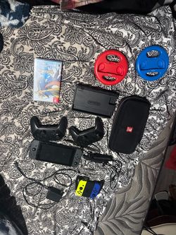 Nintendo switch 1 with a game and additional items
