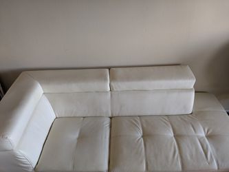 Comfy white faux leather couch, $30