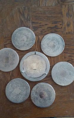 Set of vintage silver coasters