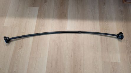 Curved shower curtain rod