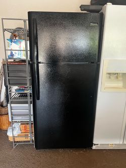 top freezer black refrigerator