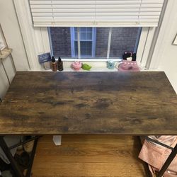 Wooden desk with holder on side