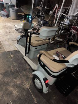 A scooter for three persons