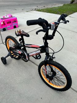 16” bike with training wheels, seat has rip