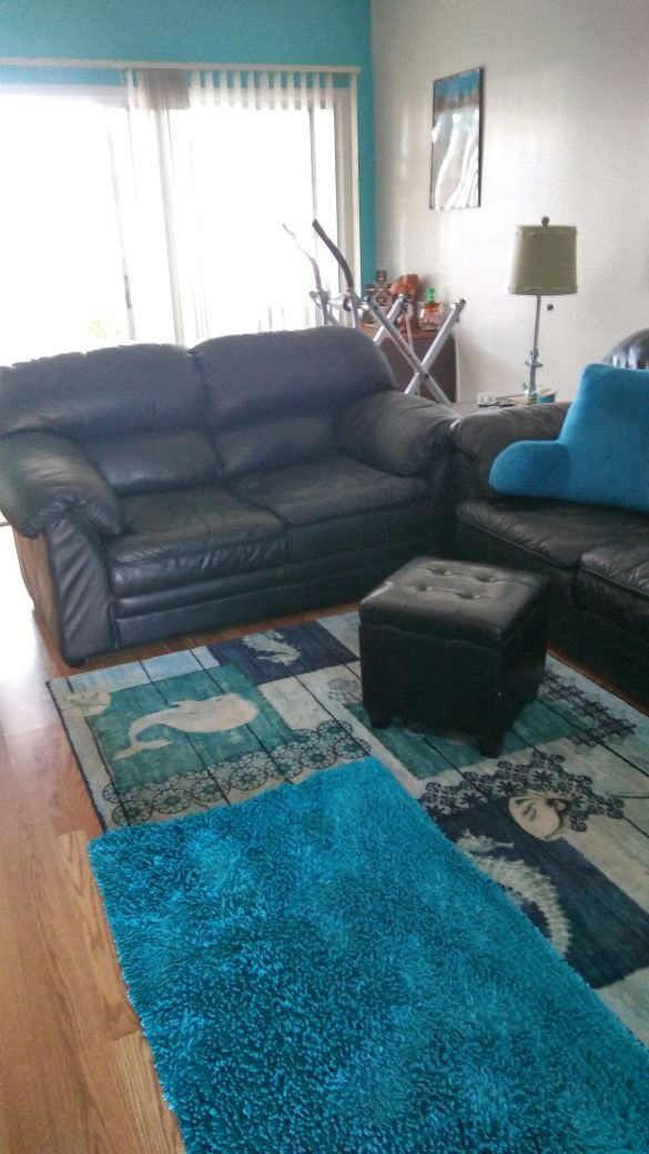 Black leather sofa and loveseat