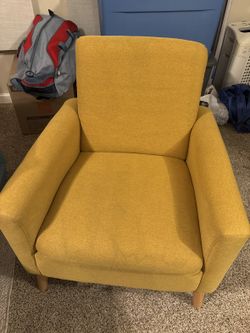 Mustard-yellow upholstered armchair