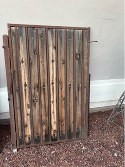 wrought iron and wood slat pedestrian gate