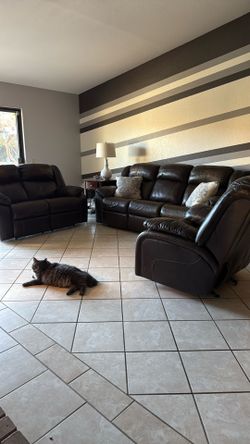 Ashley Furniture Leather couch, love seat, with  powered reclining features