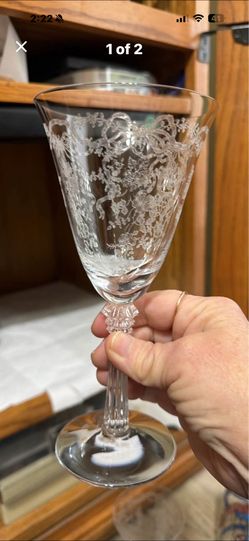 This is a Fostoria Chintz etched water goblet. This collectible crystal glass features