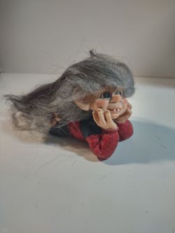 Norwegian Troll Laying on Elbows with Head in Hands