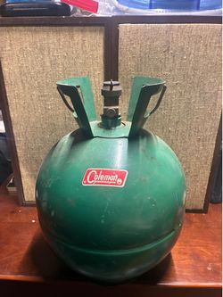 vintage green Coleman round propane tank