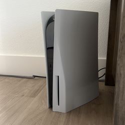 PS5 + 2 Controllers w/ Charging Station, 8 Games, and Headset