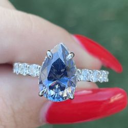 3 carat blue pear moissanite Diamond Engagement Ring on a pavé band 14k white gold 