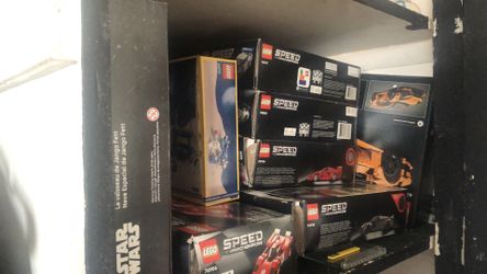 pile of open legos but each set is in tact