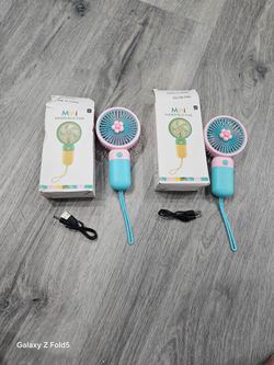 Two Mini handheld  fans. Both for $10