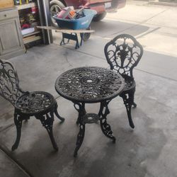 Heavy Cast Iron Table And Chairs 