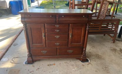 brown cabinet with mirror head board