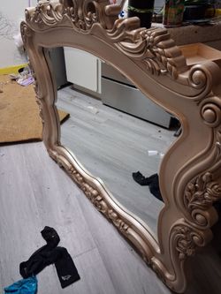 Beautiful curved and bevelled mirror in Baroque Bohemian frame.