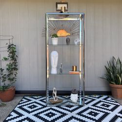 Vintage chrome etagere with glass shelves . 