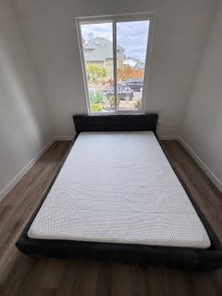 Grey cushion queen sized bed frame (mattress not included)
