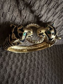 Black enamel, double headed bracelet, cats, panthers, tigers