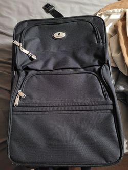 Leisure Luggage Bag W/ Wheels/Extendable Handle 2X Zipper exterior compartments.