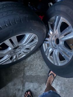 4 Cadillac aluminum rims and tires free
