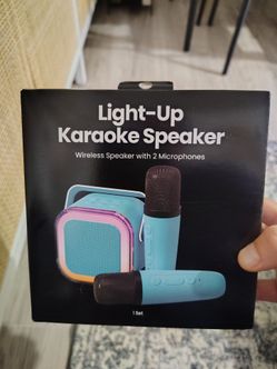 Karaoke speaker set includes one speaker and two microphones