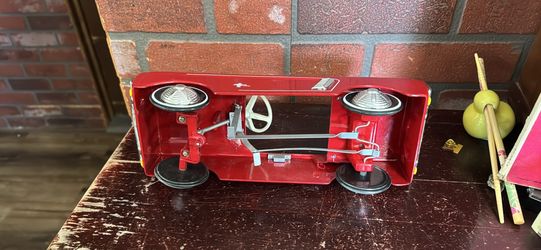 Miniature metal Ford Mustang pedal car