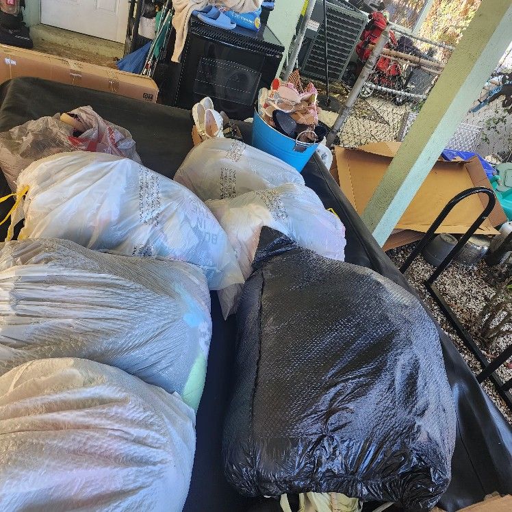 6 Bags Of Clothes And A Bucket Of Shoess