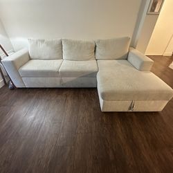 Living Spaces Sebastian Cream White Sleeper Sectional