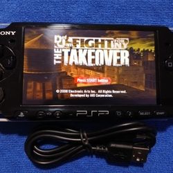PSP 3000 With Charger And Games Inside. Works 