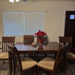 Wooden table and 6 chairs 