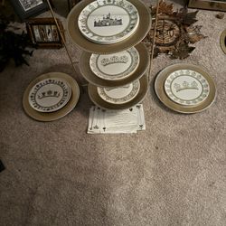 Disneyland Eight Collectible plates with documentation, sign, and numbered in a beautiful gold Stan